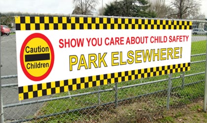 Parking-Safety-Banner-on-a-Fence2