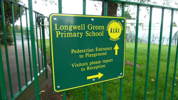 School Sign on a Gate
